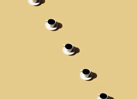 Pattern of white cup and saucer plate of black espresso coffee top view with Foto stock