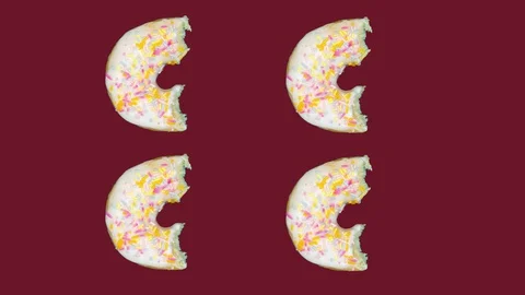 Pattern with white glazed donut with sprinkles, disappearing bite by bite. Stock Footage 128923140