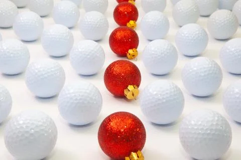 Pattern with white golf balls and red Christmas decoration Photos
