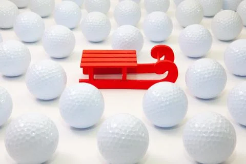 Pattern with white golf balls and Santa Claus red carriage Foto stock