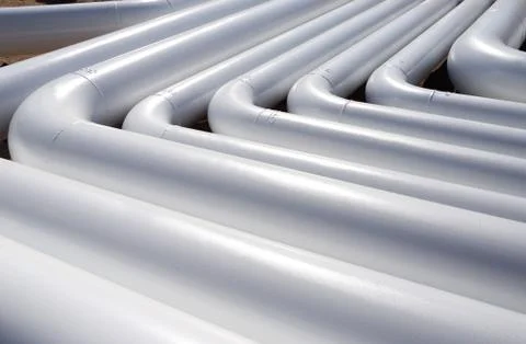 Pattern of a white new pipes Stock Photos