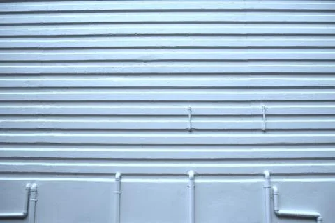 Pattern white plaster walls and water pipes. Stock Photos