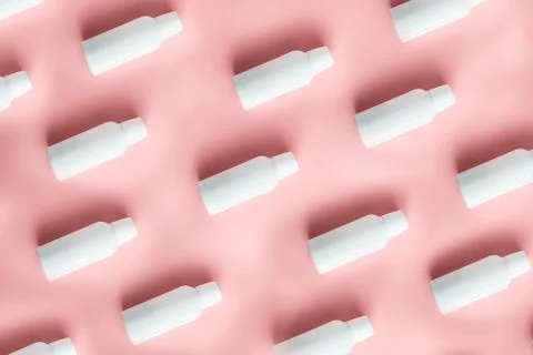 Pattern of white plastic bottles of containers for dairy products Stock Photos