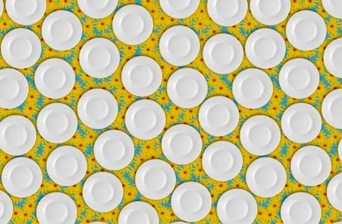 Pattern, white plates on the backdrop of bright yellow flowers, not seamless. Foto stock