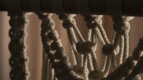 Pattern of whites macrame threads on a stick for decoration or home decor. Home Stock Footage 172233905