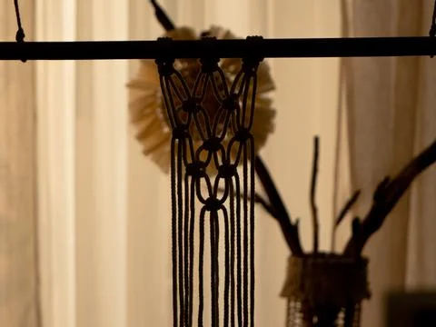 Pattern of whites macrame threads on a stick for decoration or home decor. Home 写真素材