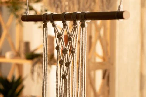 Pattern of whites macrame threads on a stick for decoration or home decor. Home Stock Photos