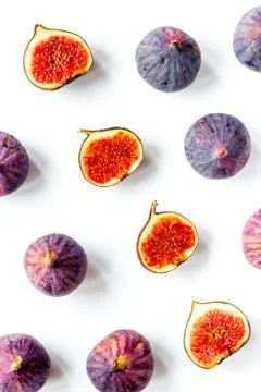Pattern of whole and sliced figs. Overhead view Stock Photos