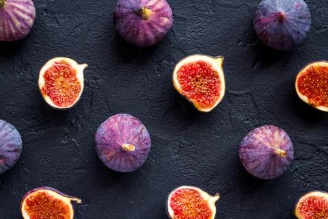 Pattern of whole and sliced figs. Overhead view Stock Photos