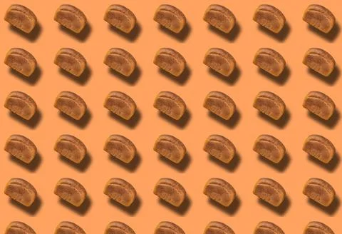 A pattern of a whole loaf of black bread with a shadow. Food template. Foto stock