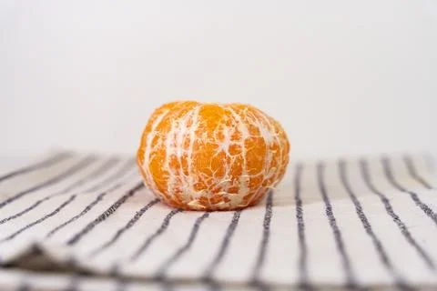 Pattern of whole tangerines or mandarin orange fruits and peeled segments i.. Stock Photos