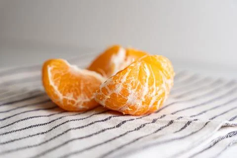 Pattern of whole tangerines or mandarin orange fruits and peeled segments iso Stock Photos