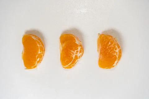 Pattern of whole tangerines or mandarin orange fruits and peeled segments iso Stock Photos