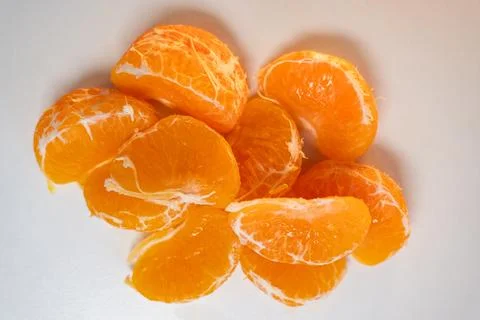Pattern of whole tangerines or mandarin orange fruits and peeled segments iso Stock Photos