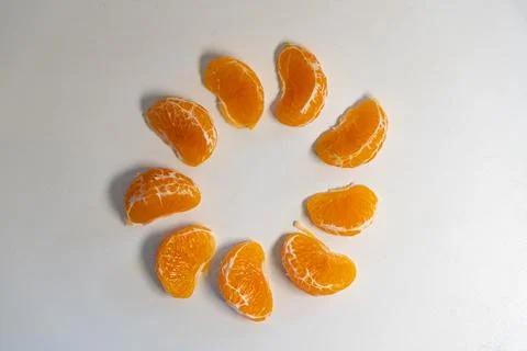 Pattern of whole tangerines or mandarin orange fruits and peeled segments iso Stock Photos