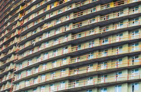 Pattern of windows in condominium room with attached small balcony. Fotos Stock