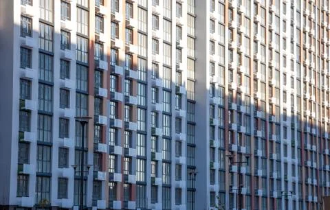 Pattern from the windows of a new multi-storey building. Window in modern arc Stock Photos
