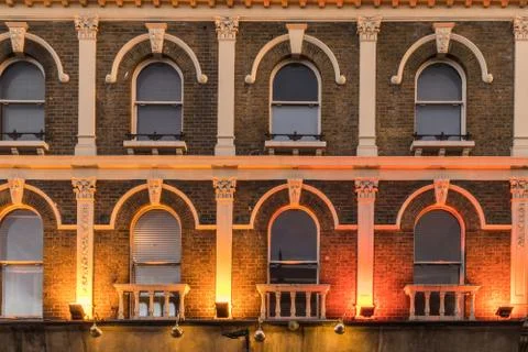 Pattern of windows in a old victorian building Stock Photos