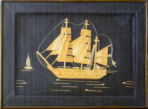 Pattern of wood chips. Sailing ship at sea. Black background. Craft ship sail Stock Photos
