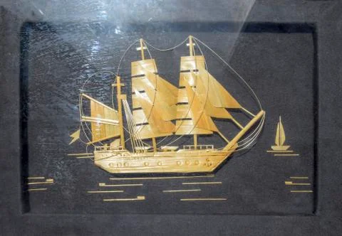 Pattern of wood chips. Sailing ship at sea. Black background. Craft ship sail Stock Photos