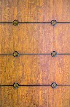 Pattern, wooden panel. Old texture of a wooden cabinet or chest of drawers. Photos