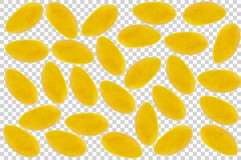 Pattern of yellow oval-shaped mango slices arranged on a light wooden backg.. Stock Photos