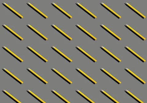 Pattern with yellow pencils on a gray background. Foto stock