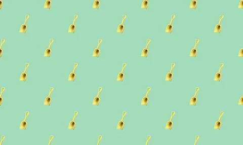 Pattern of yellow shovels on green background Stock Illustration