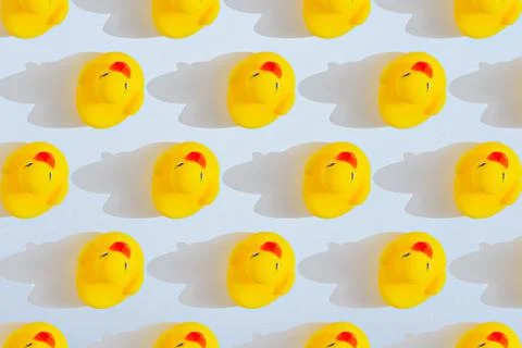 Pattern of yellow toy ducklings with shadow Stock Illustration
