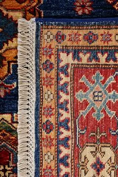 Patterned Afghan rugs on a white background Stock Photos