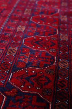 Patterned Afghan rugs on a white background Stock Photos