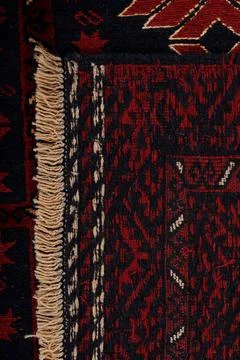 Patterned Afghan rugs on a white background Stock Photos