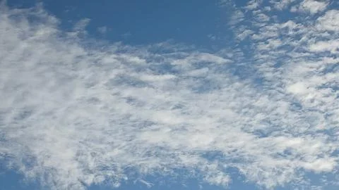 Patterned Altocumulus Clouds in a Clear Blue Sky 写真素材