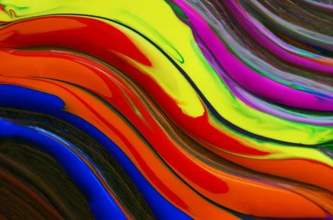 Patterned background of various flowing colors. Unique colorful background. Stock Photos