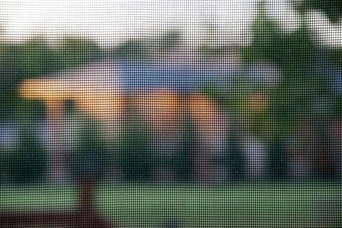 Patterned black net on the window for bugs Stock Photos