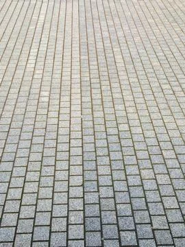 Patterned brick walkway tiles with geometric paving lines Stock Photos