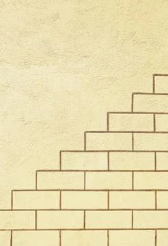 Patterned brick wall, detail of a wall decorated with paintings, urban decor, Stock Photos