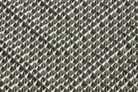 A patterned decorative wall on the outside of a building Stock Photos