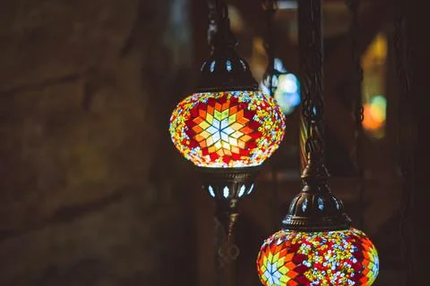 Patterned lamp hanging from glass Stock Photos