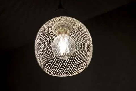 Patterned light chandelier with light bulb Stock Photos