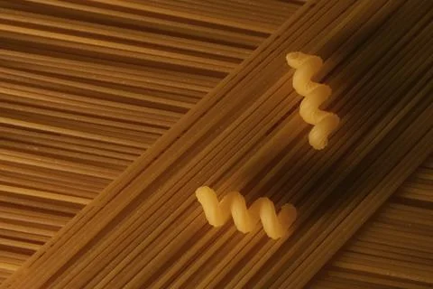 Patterned pasta made from spaghetti and spirelli Stock Photos