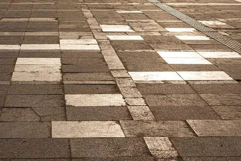 Patterned pavement with white stripes Stock Photos