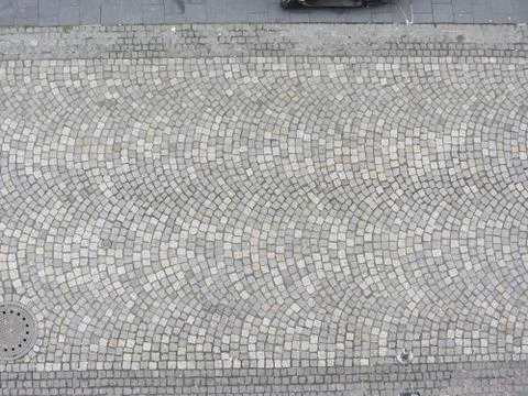Patterned paving tiles, cement brick floor background Stock Photos