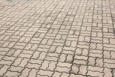Patterned paving tiles, cement brick floor background Stock Photos