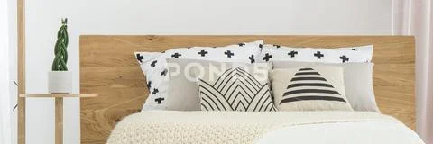 Patterned pillows on bed Stock Photos