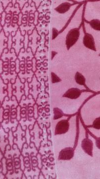 Patterned pink fabric with scroll and leaf motifs 스톡 사진