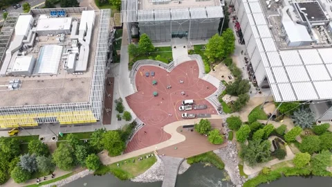 Patterned red plaza and water feature at the heart of a modern office park Stock Footage 343822993