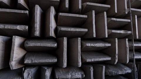 Patterned soundproof crates against the wall Stock Footage 93577922