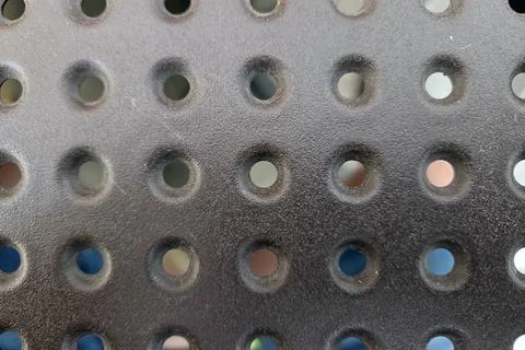 Patterned Surface with Circular Perforations Industrial Design Texture Stock Photos