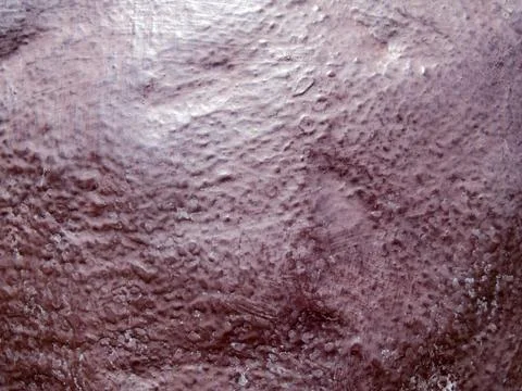 The patterned texture of the red crimson wall concrete, Background images Stock Photos